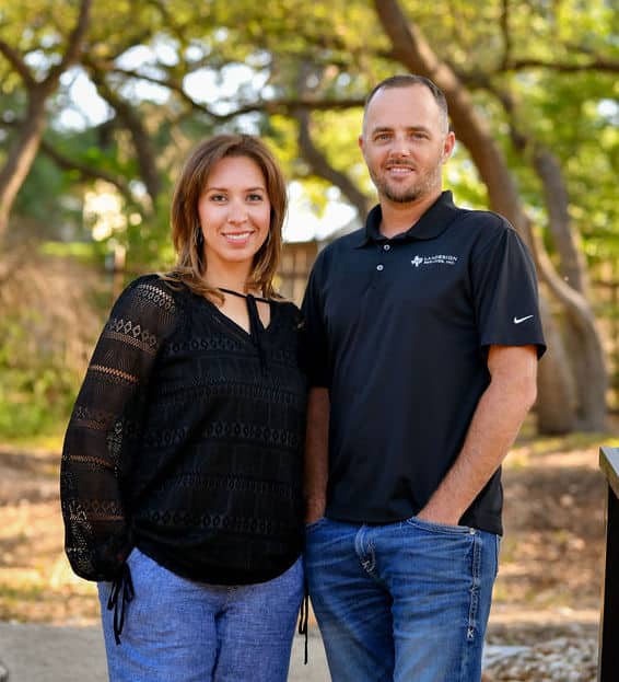 Vice President and President pose for company photo wearing black shirts